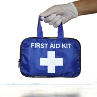 A hand holding a first aid bag A hand holding a first aid bag