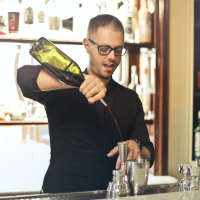 A man making a cocktail A man making a cocktail