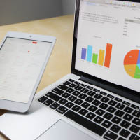 laptop and tablet showing graphs laptop and tablet showing graphs