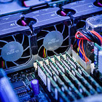 close up of inside of computer showing fans and RAM sticks close up of inside of computer showing fans and RAM sticks
