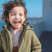 Young boy smiling at the camera Young boy smiling at the camera