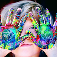Child showing painting hands Child showing painting hands