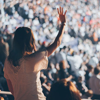 Woman raising hand to sky Woman raising hand to sky