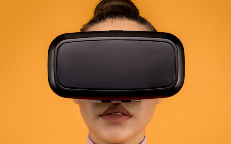 Woman wearing a VR headset Woman wearing a VR headset