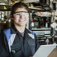 Smiling engineering student wearing PPE Smiling engineering student wearing PPE
