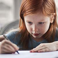 Young girl writing Young girl writing